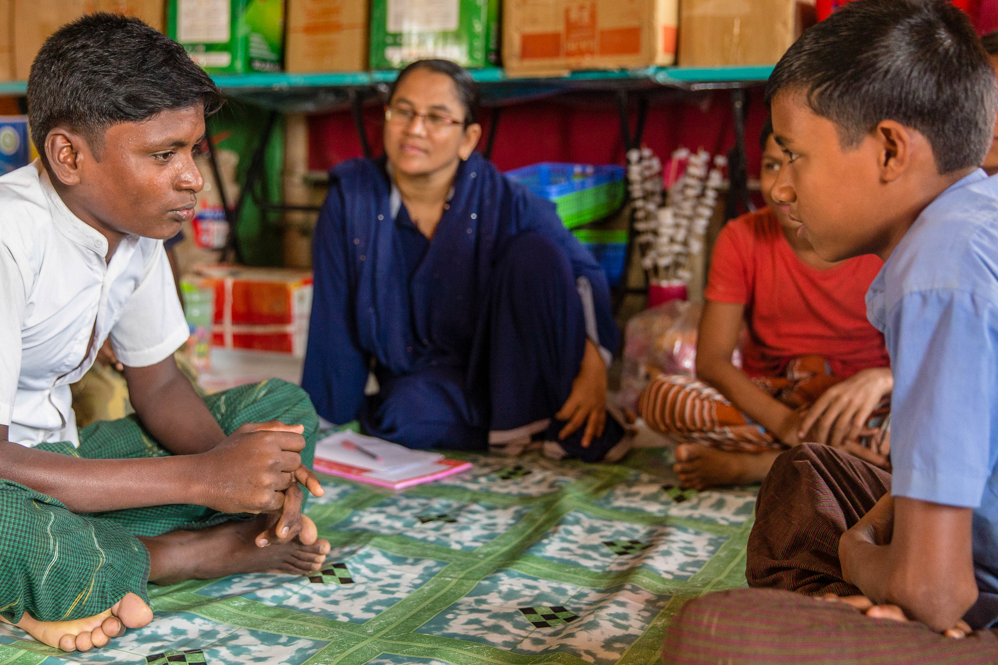 Rohingya children sit in Child Friendly Spaces in Cox's Bazar, Bangladesh
