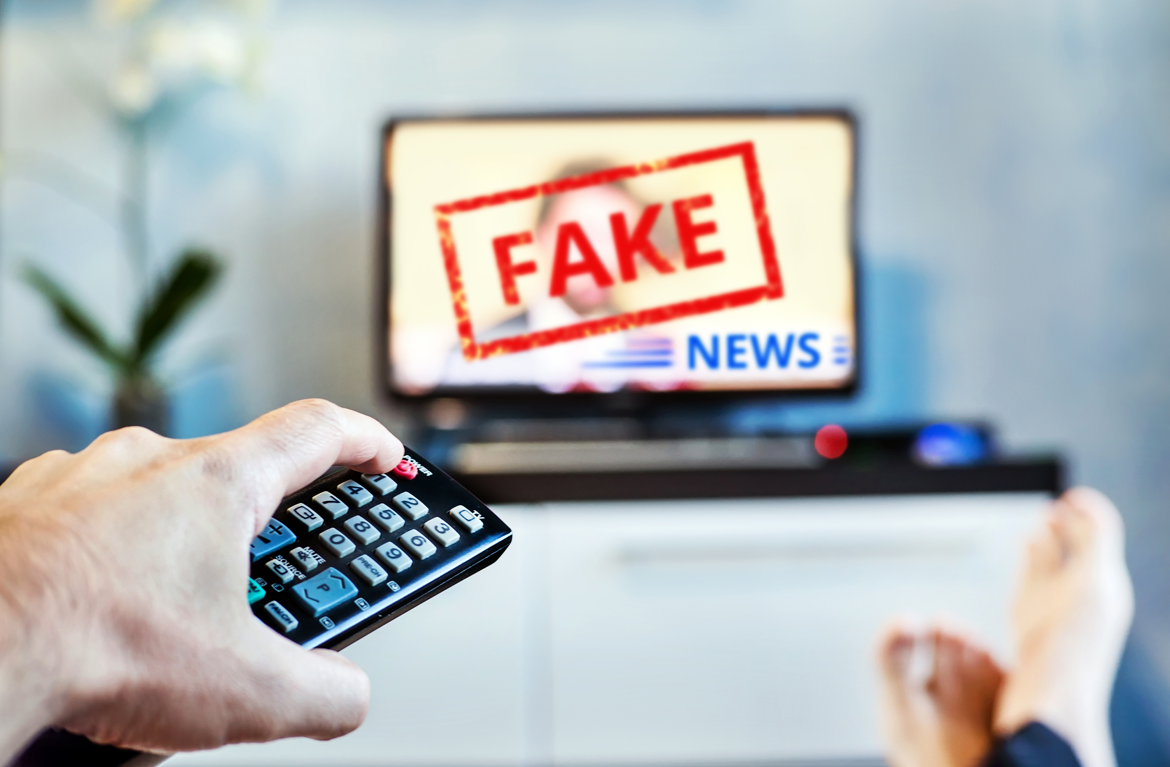 A television with the words "Fake News."
