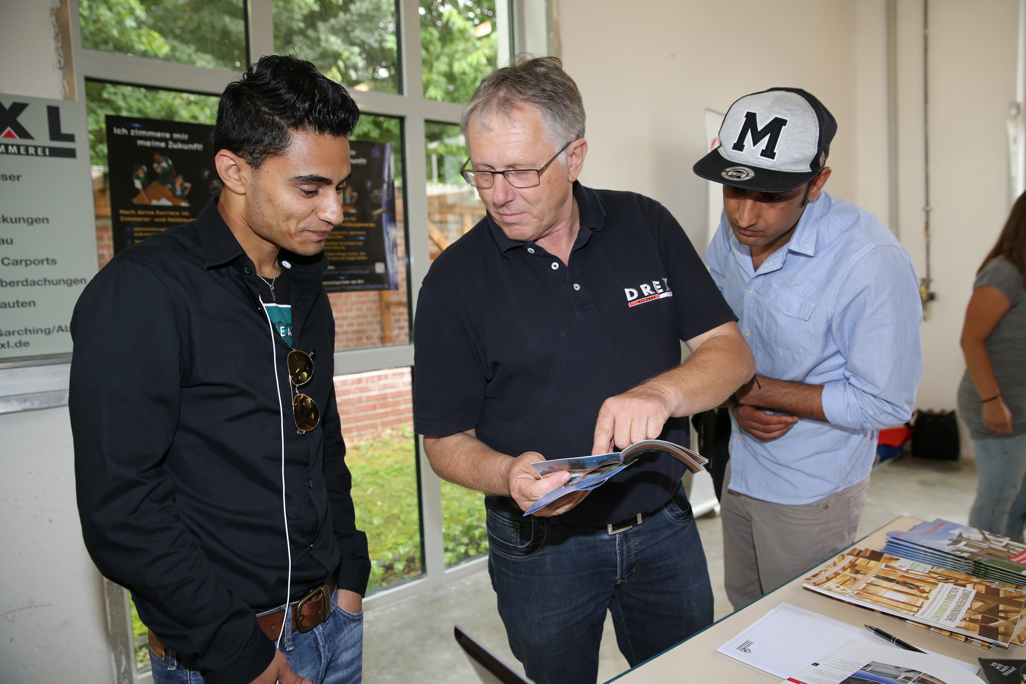 Refugees attend a job training fair