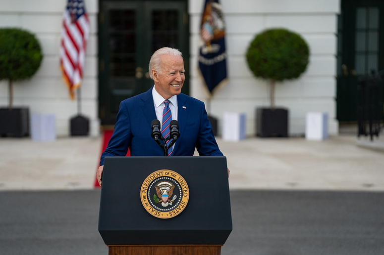 Photo of U.S. President Joe Biden delivering remarks in front of White House.