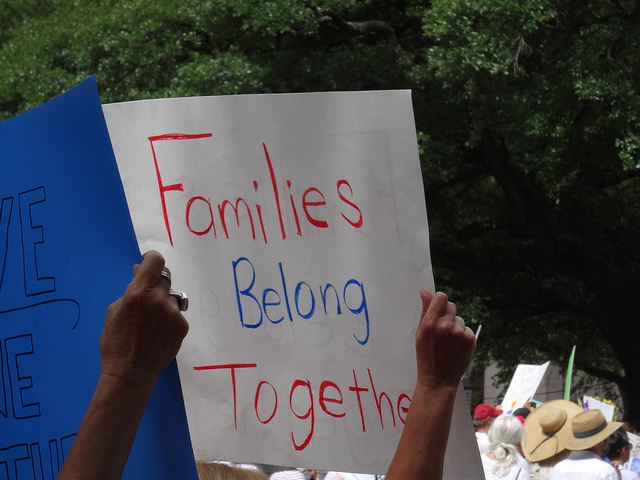 Image of families belong together event banner in Houston