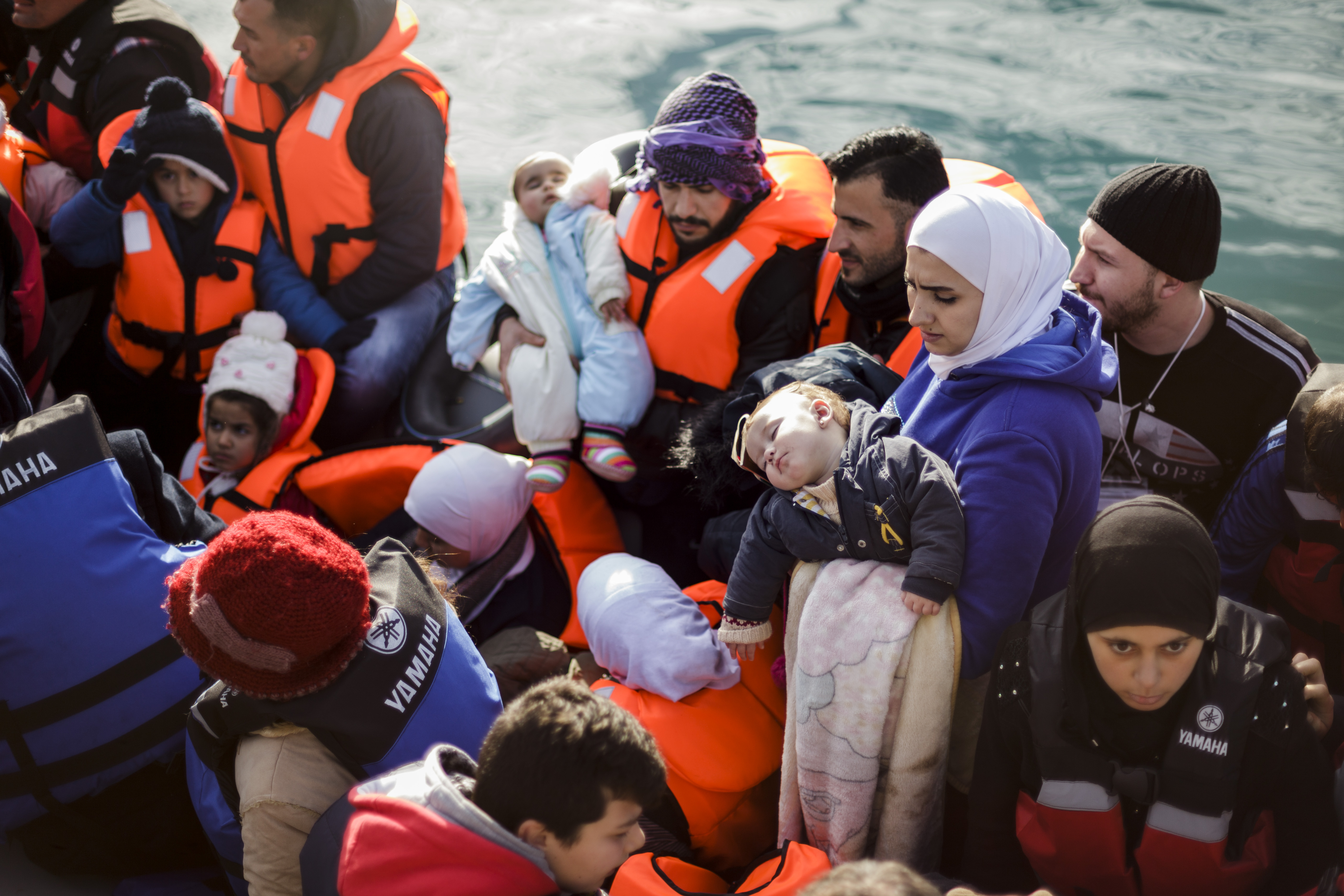 Migrants arrive in Greece on a crowded boat from Turkey.