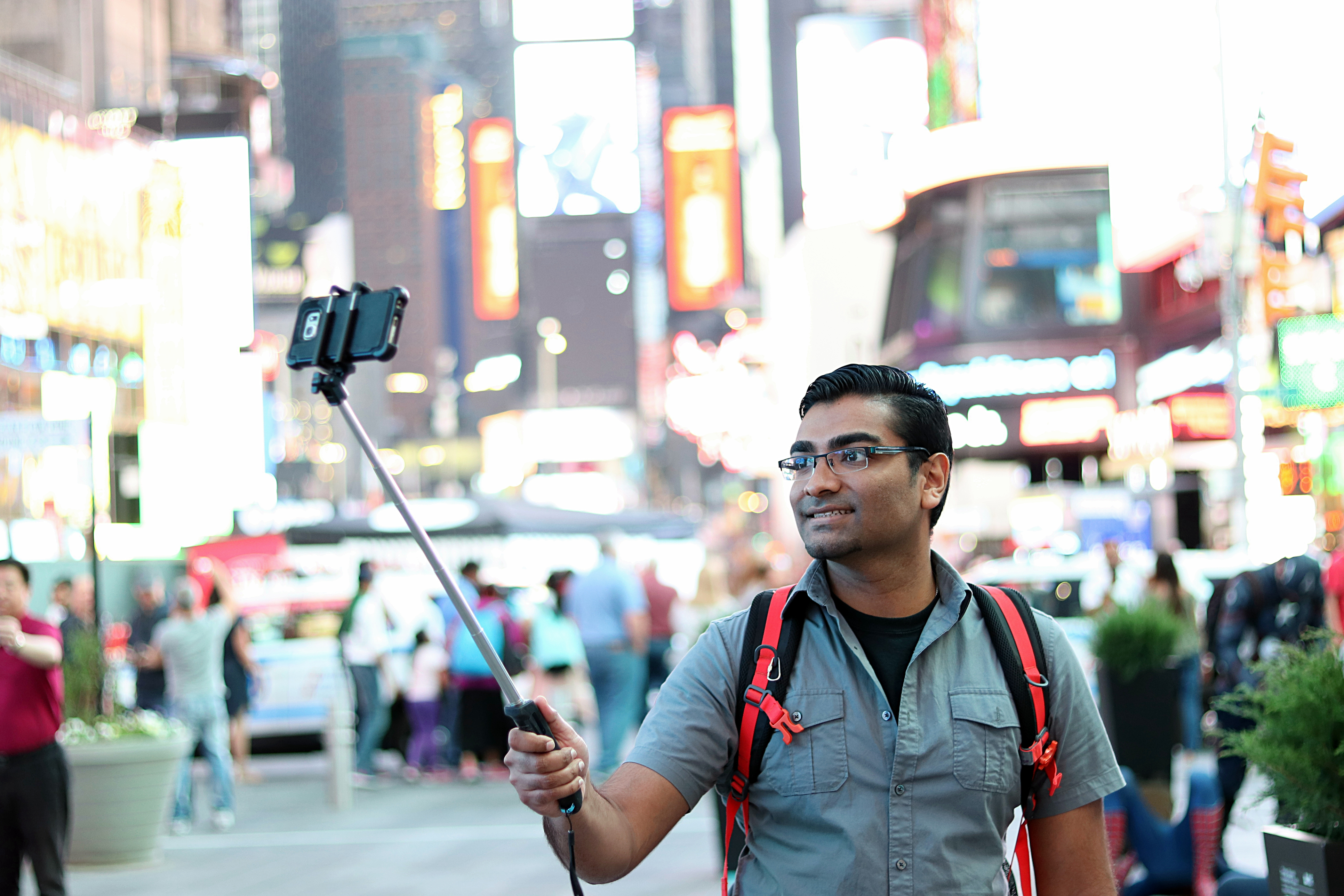 A tourist takes a selfie in New York City.