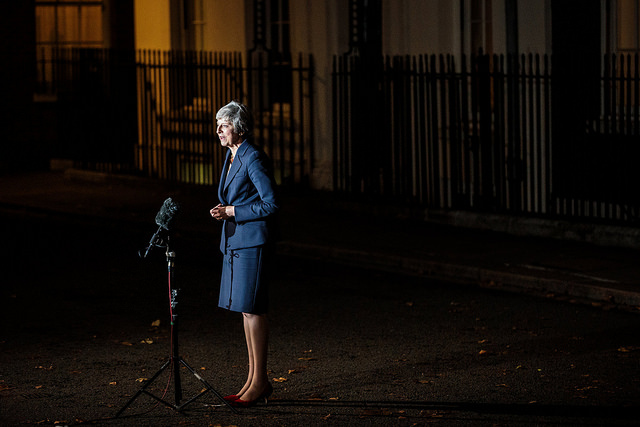 Theresa May speaks to reporters