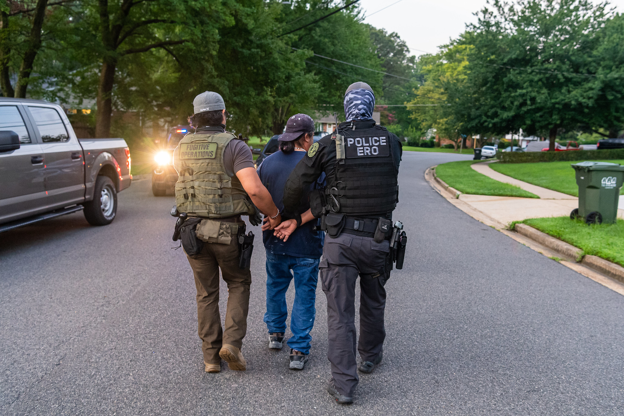 Federal immigration officers make an arrest during an operation in Virginia.