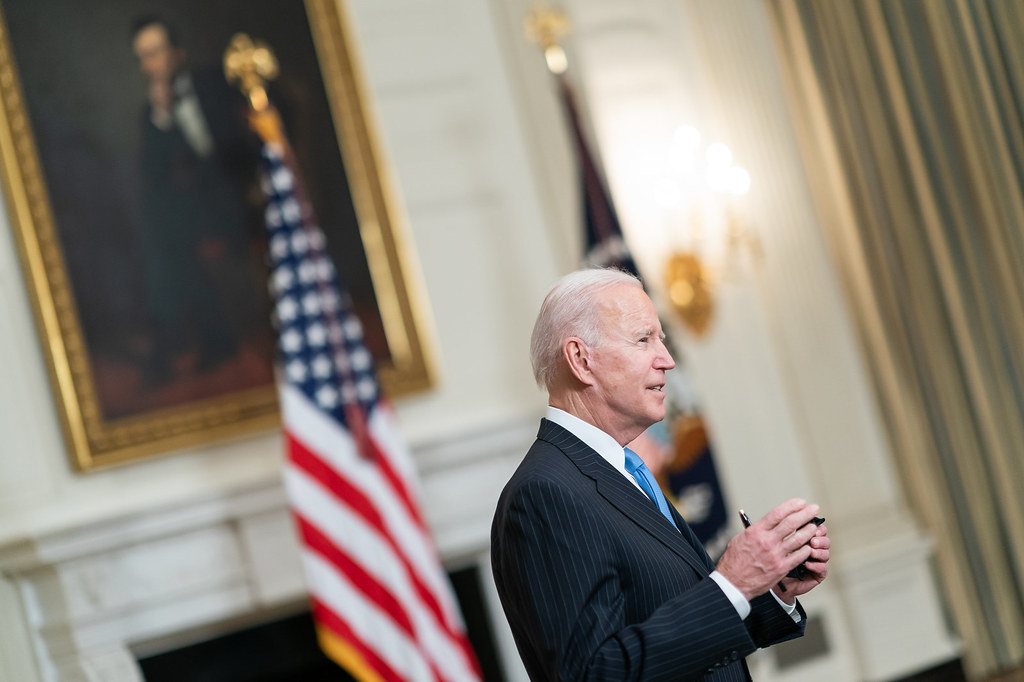 President Joe Biden speaks to journalists at the White House.