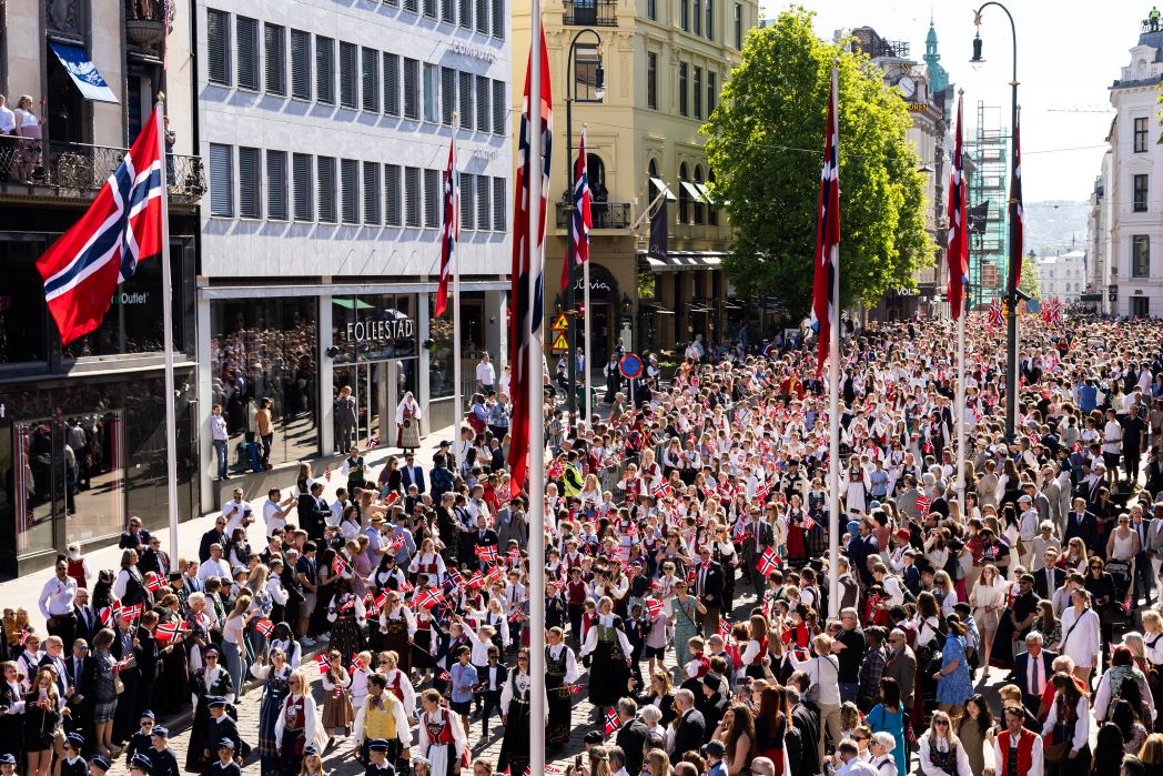 Norwegian Parliament President Masud Gharahkhani greets a children's procession