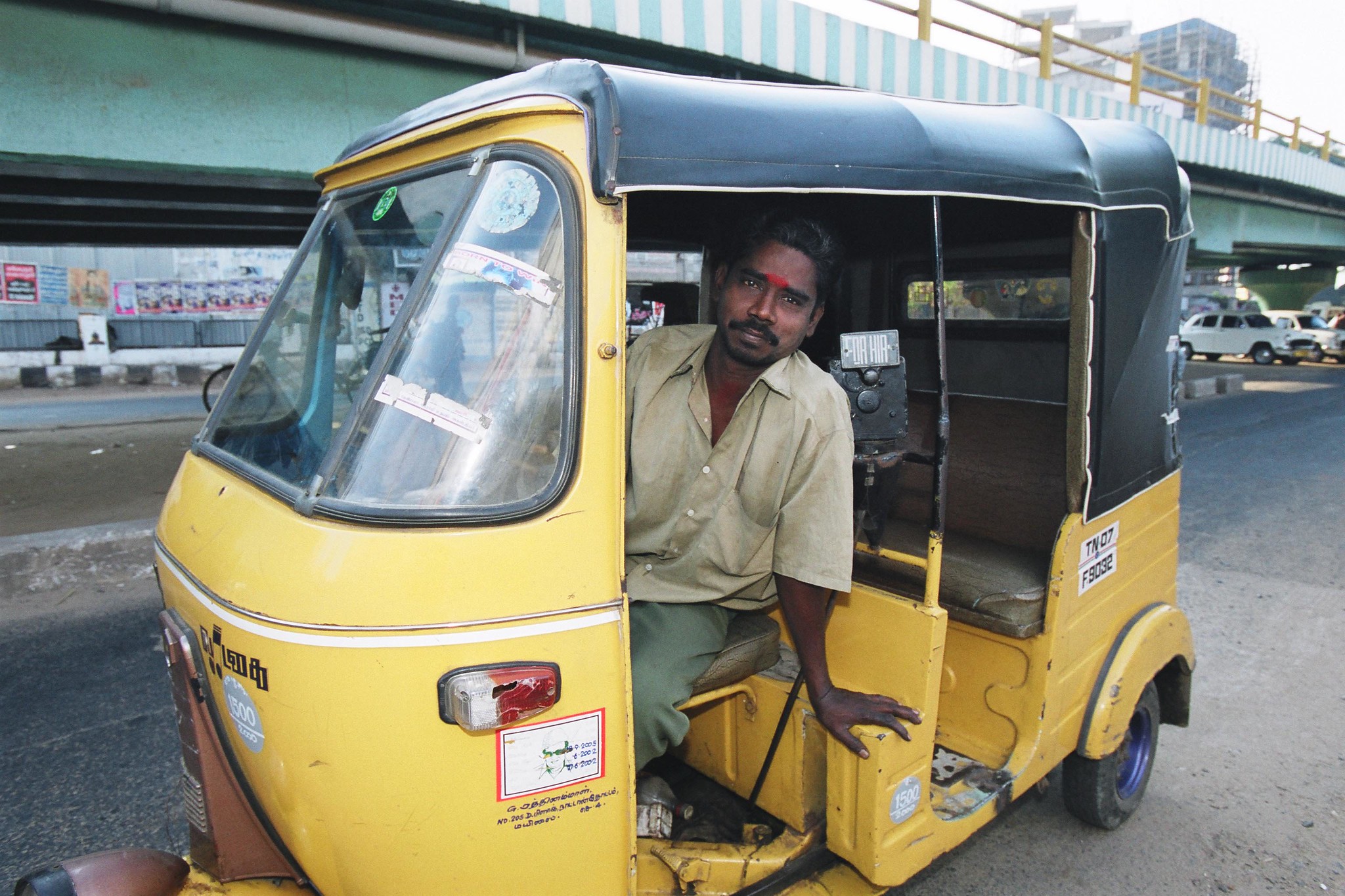 A tuk tuk driver in India.