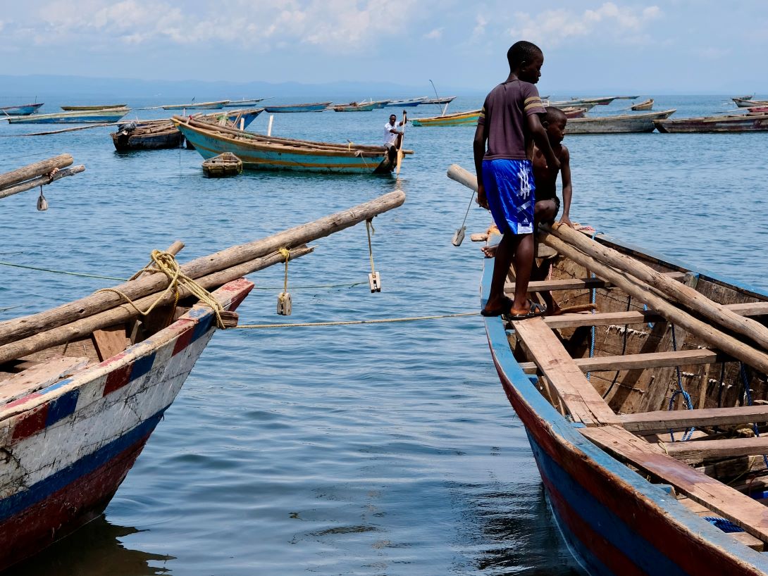 Boys on a fishing boat on the shores of Lake Tanganyika