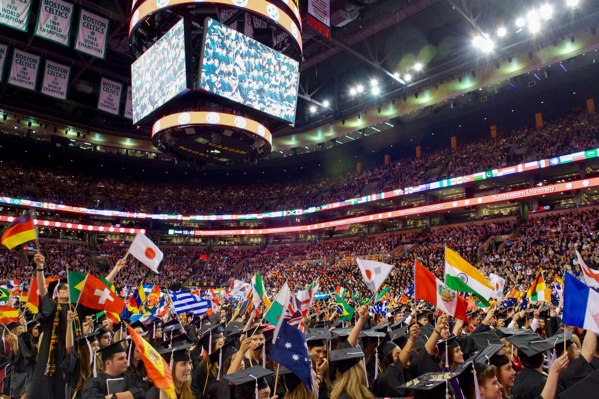 International students wave flags of their origin countries