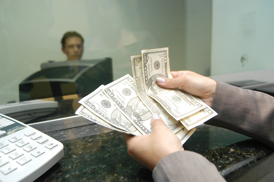 A woman receives remittances from a family member abroad.