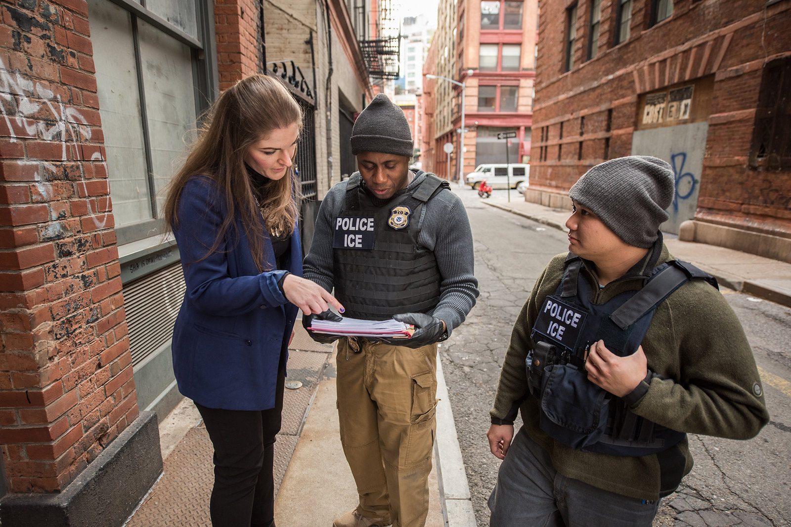 U.S. Immigration and Customs Enforcement officers consult in New York City. 