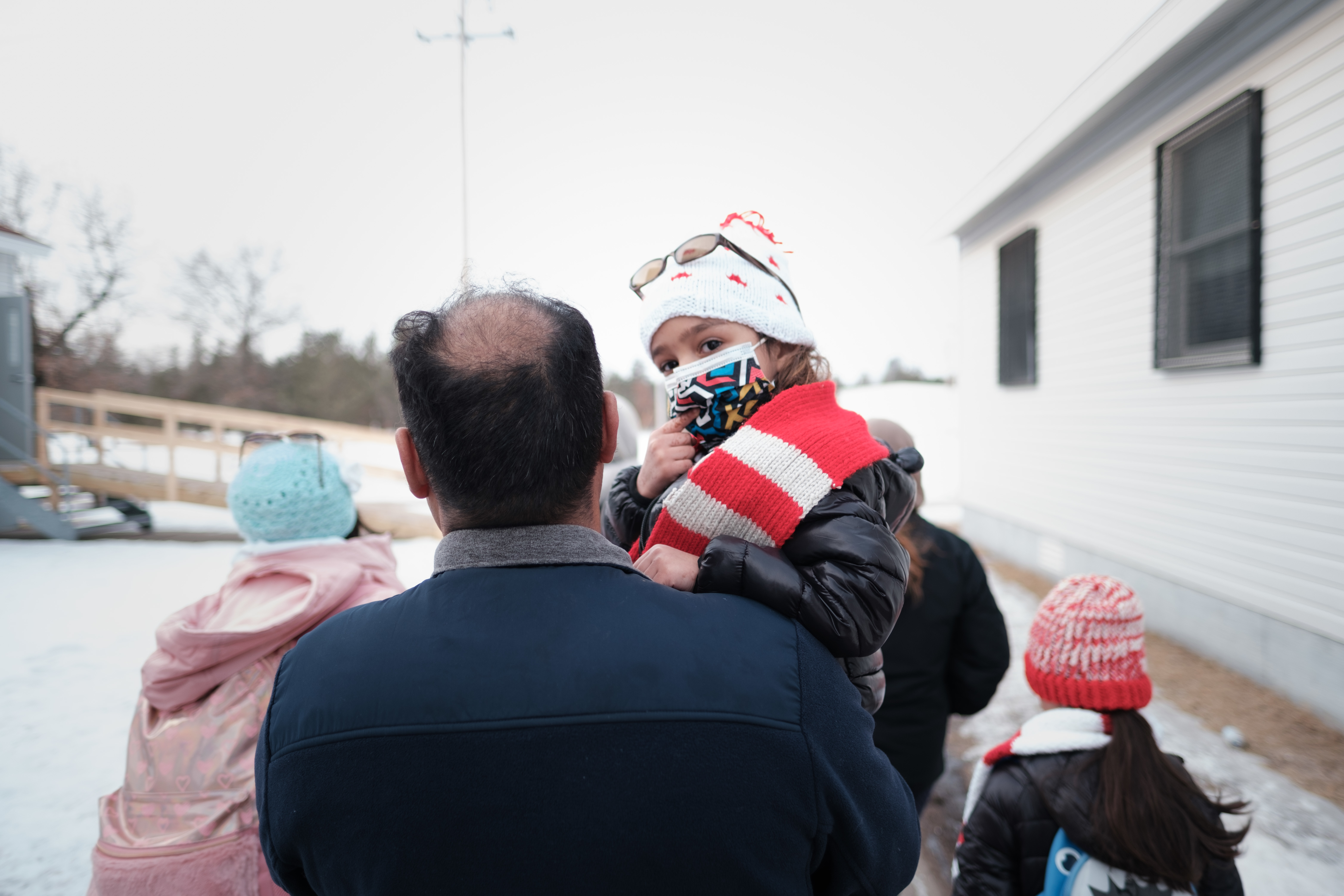 A family of Afghan evacuees leaving Fort McCoy, Wisconsin.