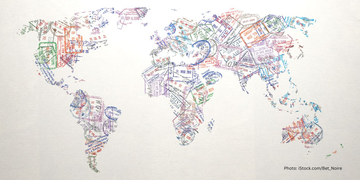 Passport stamps of different countries forming a world map.
